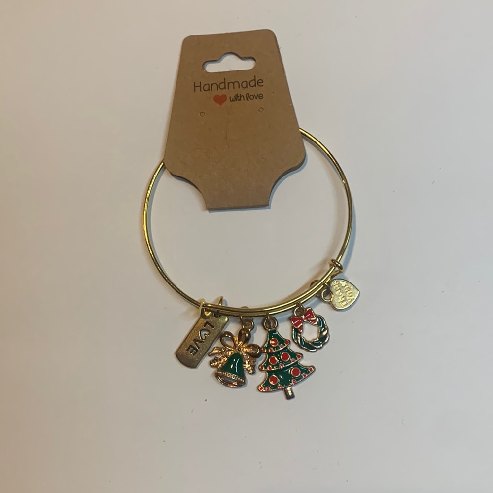 Handmade gold tone stainless steel bracelet with 5 charms.